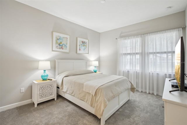 bedroom with light colored carpet