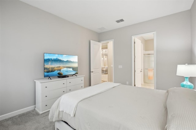 carpeted bedroom with connected bathroom