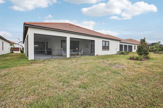 back of house featuring a yard and a patio area