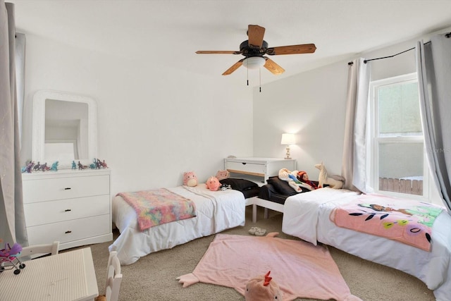 bedroom featuring ceiling fan and carpet