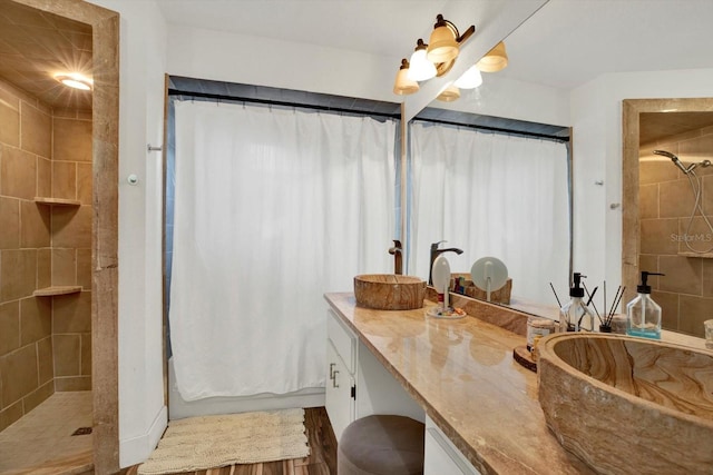 bathroom featuring a shower with curtain and vanity