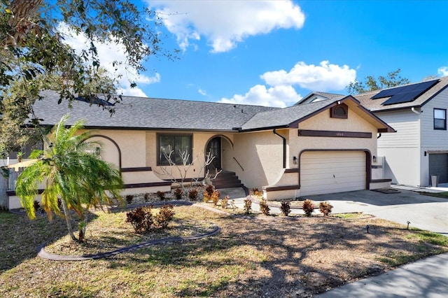 view of front of home featuring stucco siding, a garage, concrete driveway, and a shingled roof