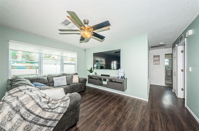 living room with ceiling fan, dark hardwood / wood-style flooring, and a textured ceiling