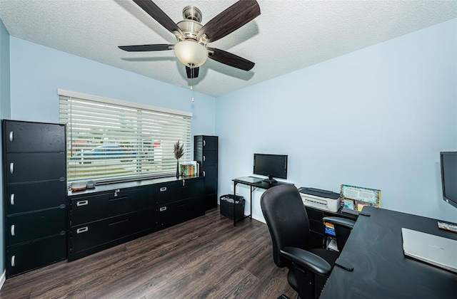 office space with ceiling fan, dark wood-type flooring, and a textured ceiling