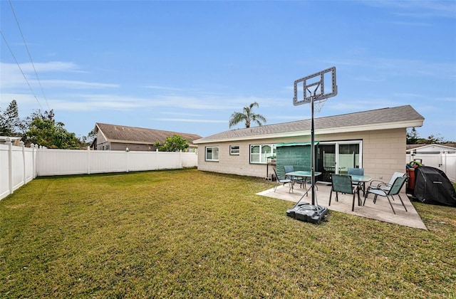 back of house featuring a patio and a lawn