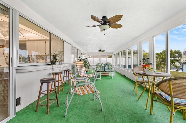 sunroom / solarium with ceiling fan