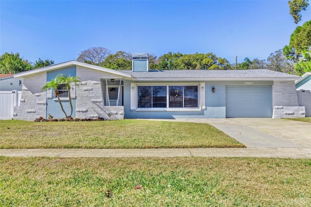 ranch-style home featuring a garage and a front lawn