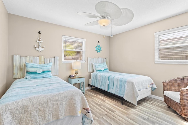 bedroom featuring ceiling fan and light hardwood / wood-style floors