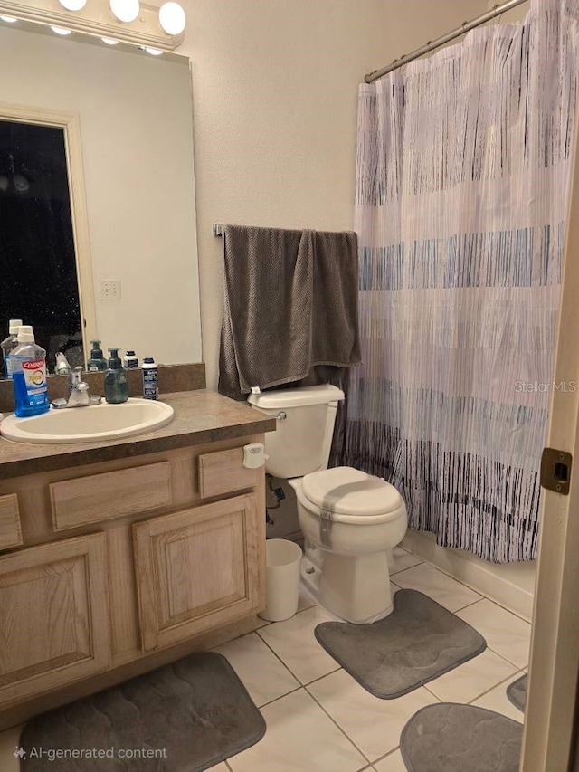 bathroom featuring tile patterned floors, toilet, curtained shower, and vanity