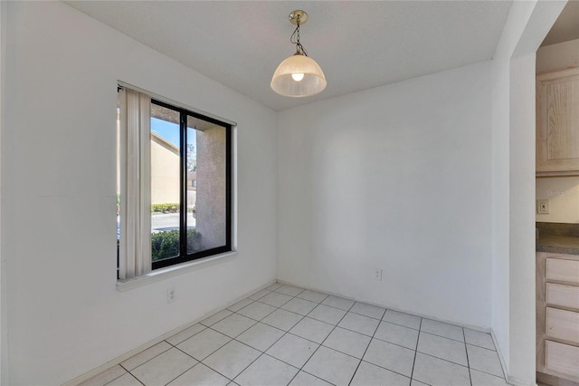 unfurnished room with light tile patterned floors