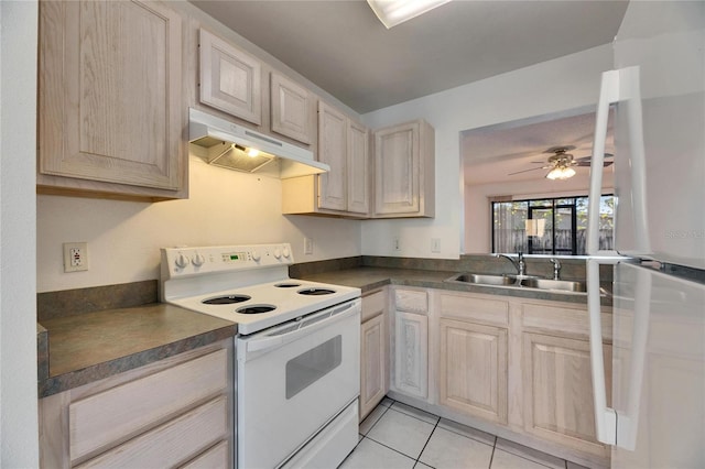 kitchen with light tile patterned floors, a ceiling fan, dark countertops, under cabinet range hood, and white range with electric cooktop