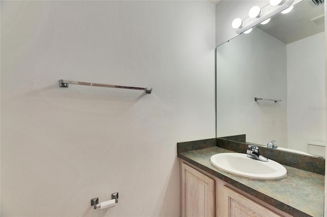 bathroom with visible vents and vanity