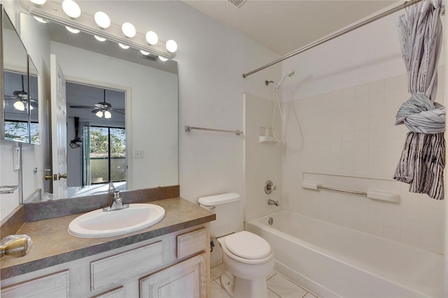 bathroom featuring tile patterned flooring, tub / shower combination, vanity, and toilet