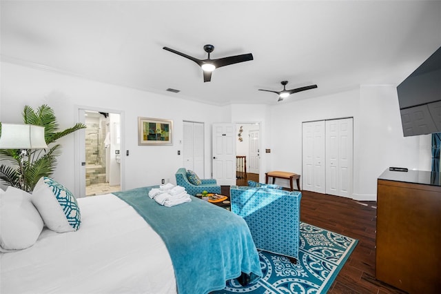 bedroom featuring ceiling fan, ornamental molding, dark wood-type flooring, and ensuite bath