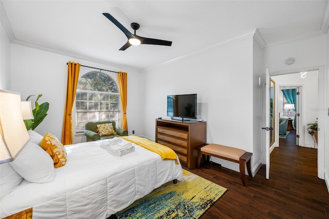 bedroom featuring ceiling fan, dark wood-type flooring, and ornamental molding