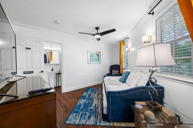 interior space featuring ceiling fan, ornamental molding, and dark hardwood / wood-style floors