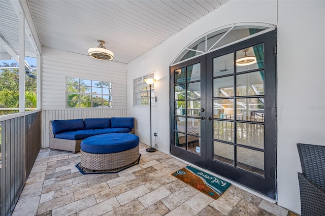 sunroom featuring french doors