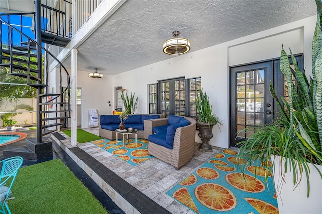 view of patio featuring a balcony and an outdoor living space