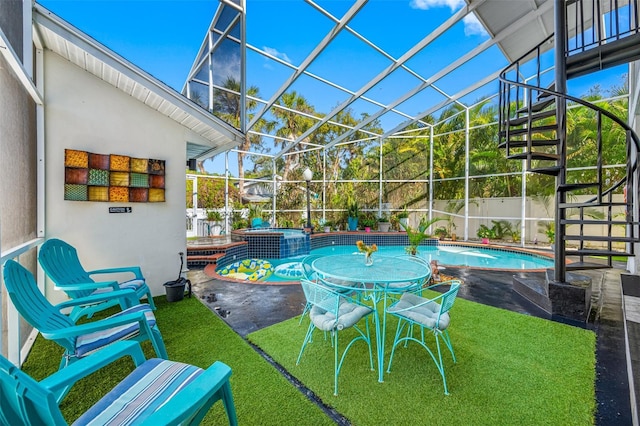 view of pool with a lawn, an in ground hot tub, a lanai, and a patio