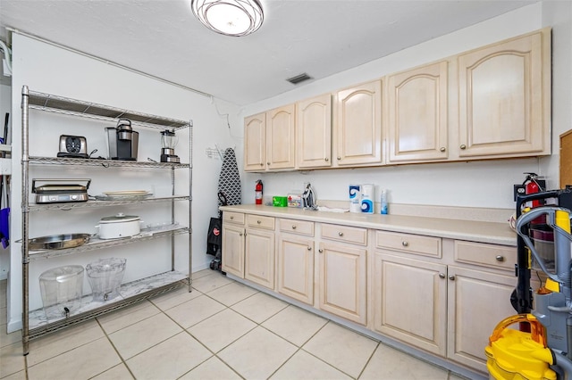 kitchen featuring light tile patterned flooring