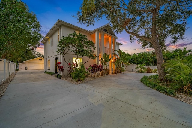 view of front of house featuring a garage and an outdoor structure