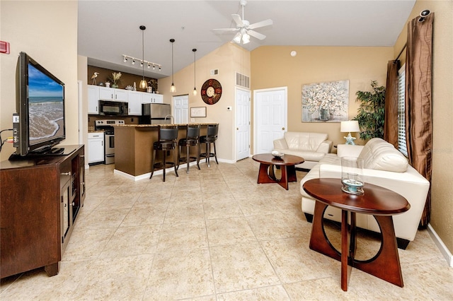 tiled living room featuring high vaulted ceiling and ceiling fan