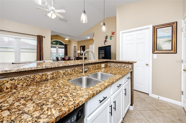 kitchen featuring sink, vaulted ceiling, stone counters, ceiling fan, and white cabinets