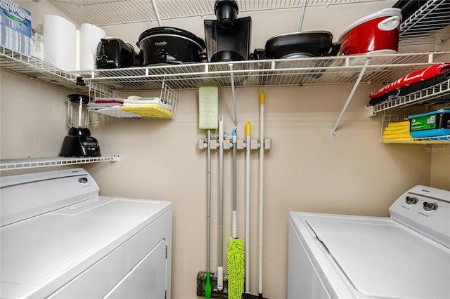 laundry area featuring washing machine and clothes dryer