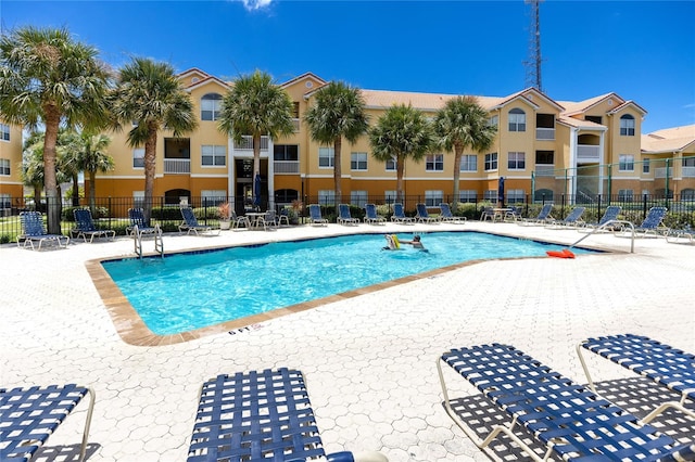 view of swimming pool with a patio