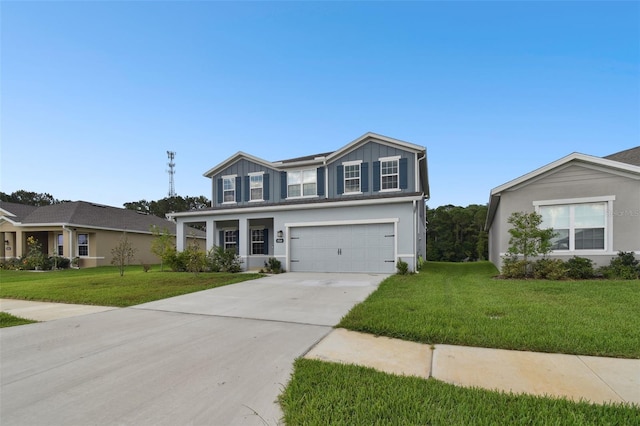 view of front of home with a garage and a front lawn