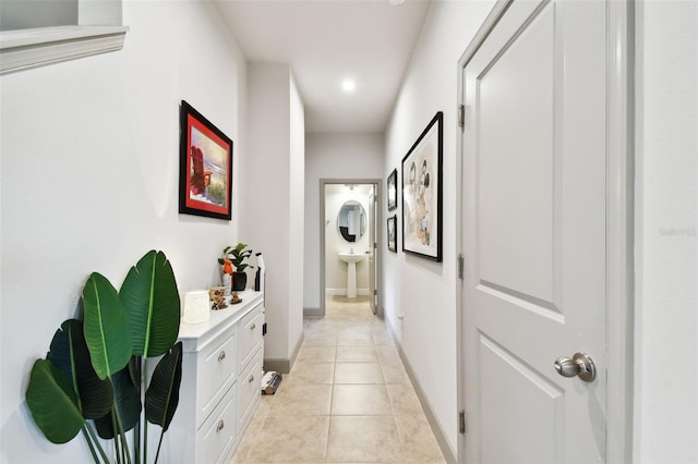 hallway featuring light tile patterned floors