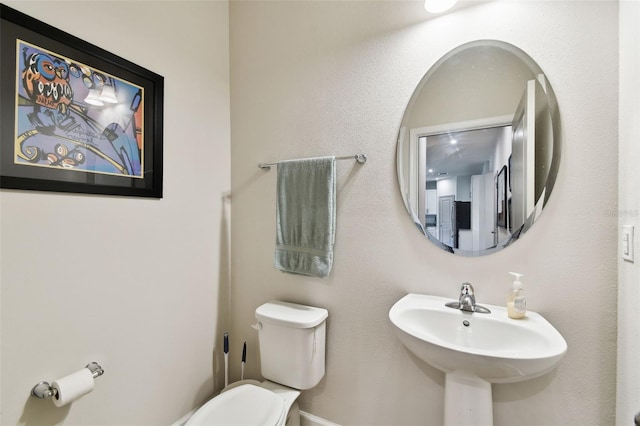 bathroom with sink and toilet