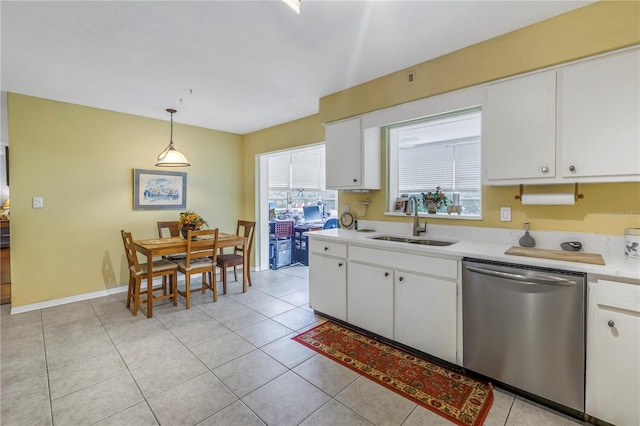 kitchen with white cabinetry, stainless steel dishwasher, sink, and hanging light fixtures