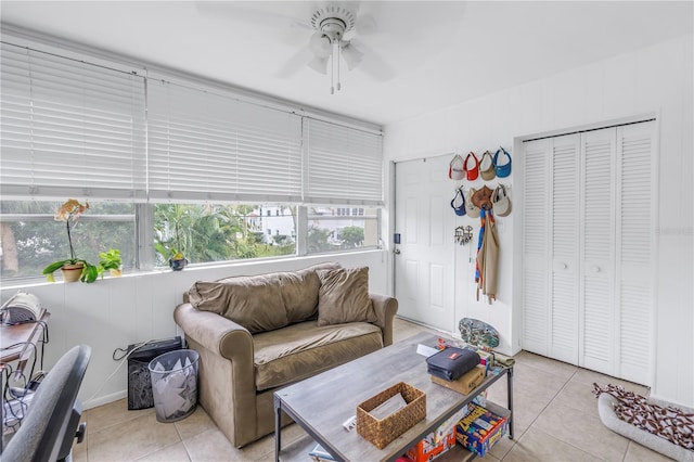 tiled living room with ceiling fan