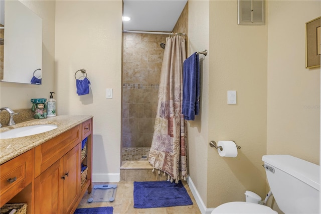 bathroom featuring vanity, toilet, curtained shower, and tile patterned flooring