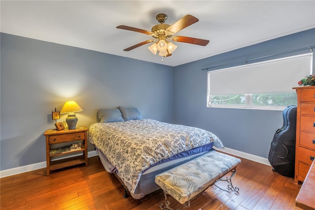 bedroom with ceiling fan and wood-type flooring