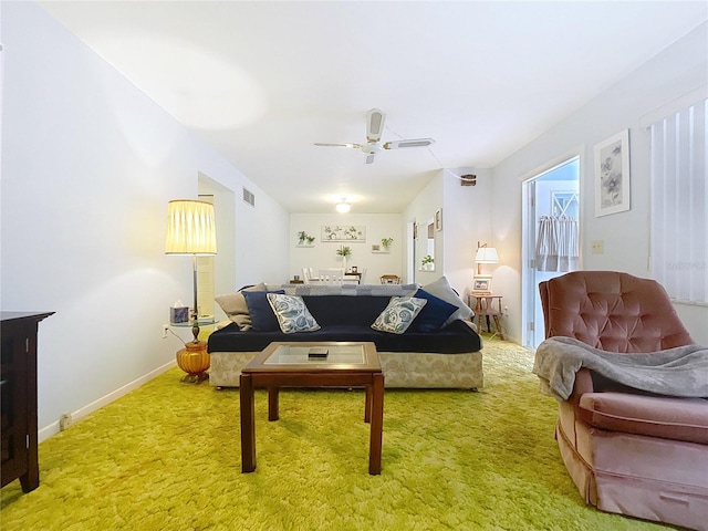 carpeted living room featuring ceiling fan