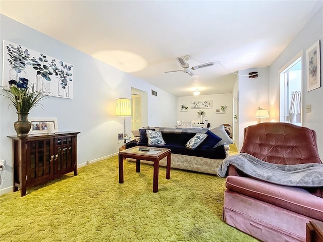 living room with ceiling fan and carpet