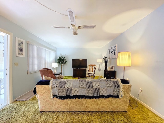 living room featuring carpet flooring and ceiling fan