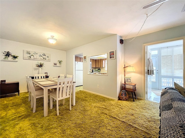 view of carpeted dining space