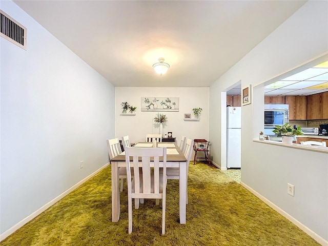 view of carpeted dining room