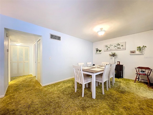 view of carpeted dining space