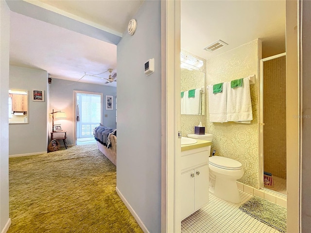 bathroom featuring vanity, an enclosed shower, ceiling fan, and toilet