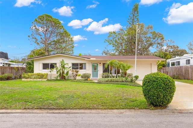 single story home with a garage and a front yard