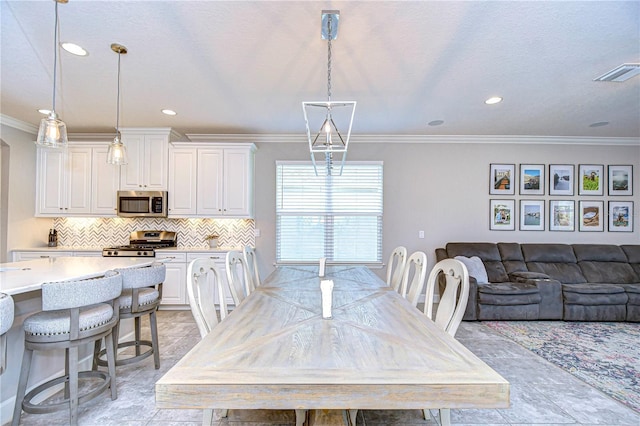 dining area featuring ornamental molding