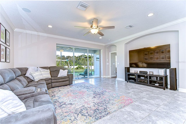 living room with a textured ceiling, ornamental molding, and ceiling fan