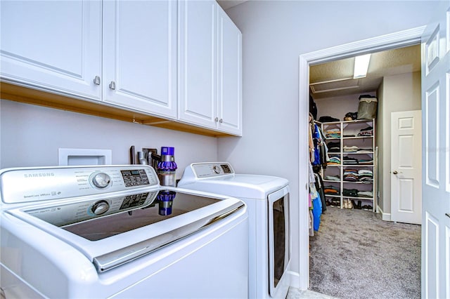 washroom with cabinets, separate washer and dryer, and light colored carpet