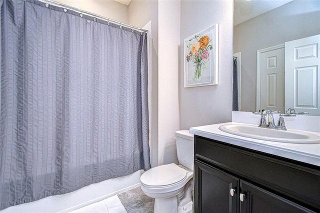 bathroom featuring vanity, tile patterned flooring, and toilet