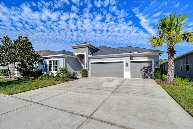 view of front of home with a garage and a front yard