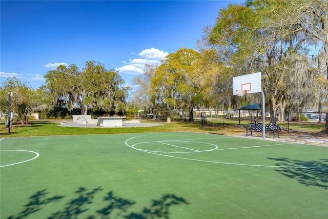 view of basketball court featuring a yard